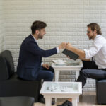 young businessman talking work with colleague in a modern busine